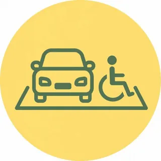 駐車スペースに止まった車と車いすマークが描かれたピクトグラム