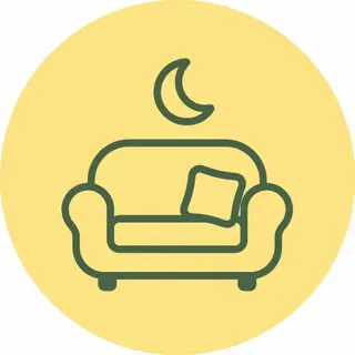 クッションの置かれたソファと三日月が描かれた、休憩室のピクトグラム