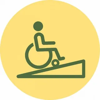 車いすの人がゆるやかなスロープを上っているピクトグラム